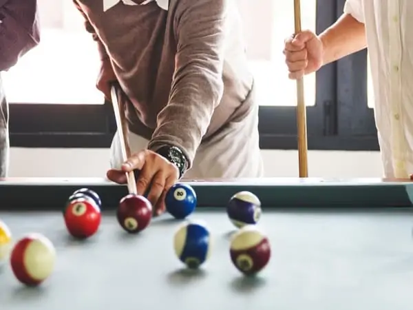 Lining up a shot in a game of billards